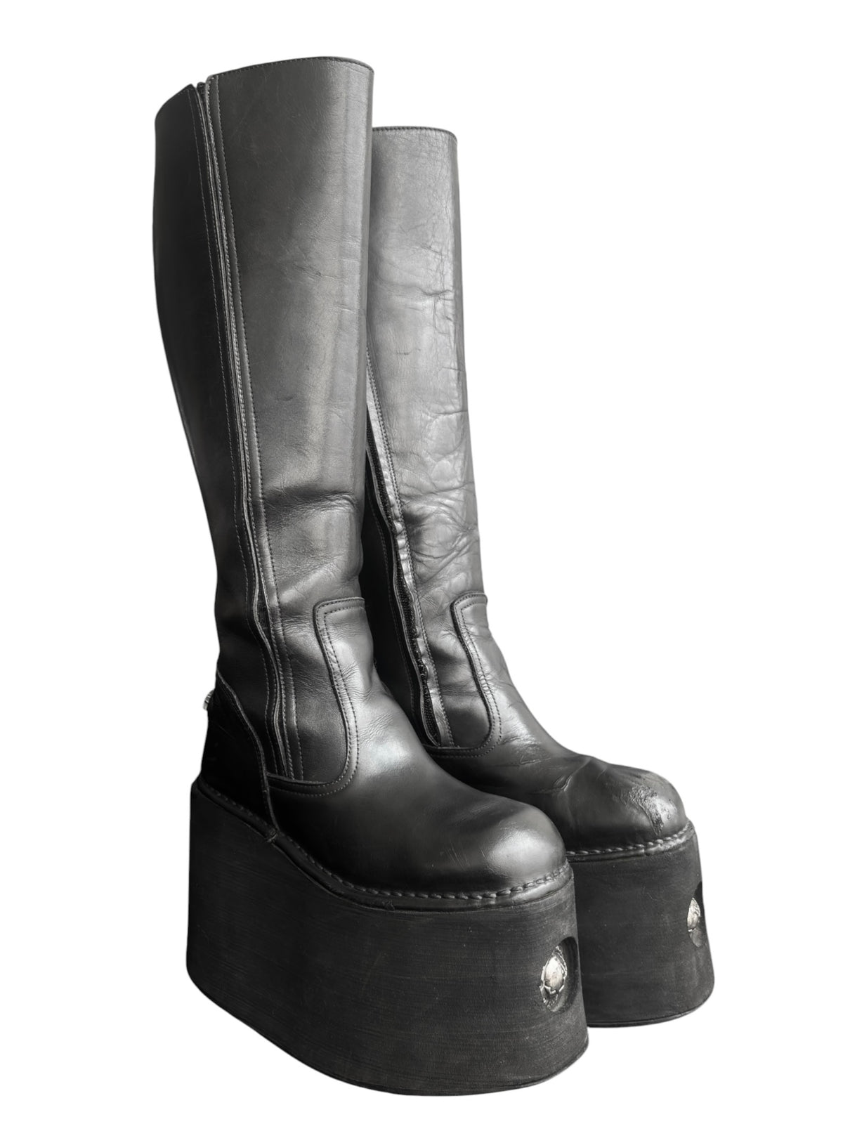 Knee-high platform boots, dark leather with side zippers and chunky rounded toes