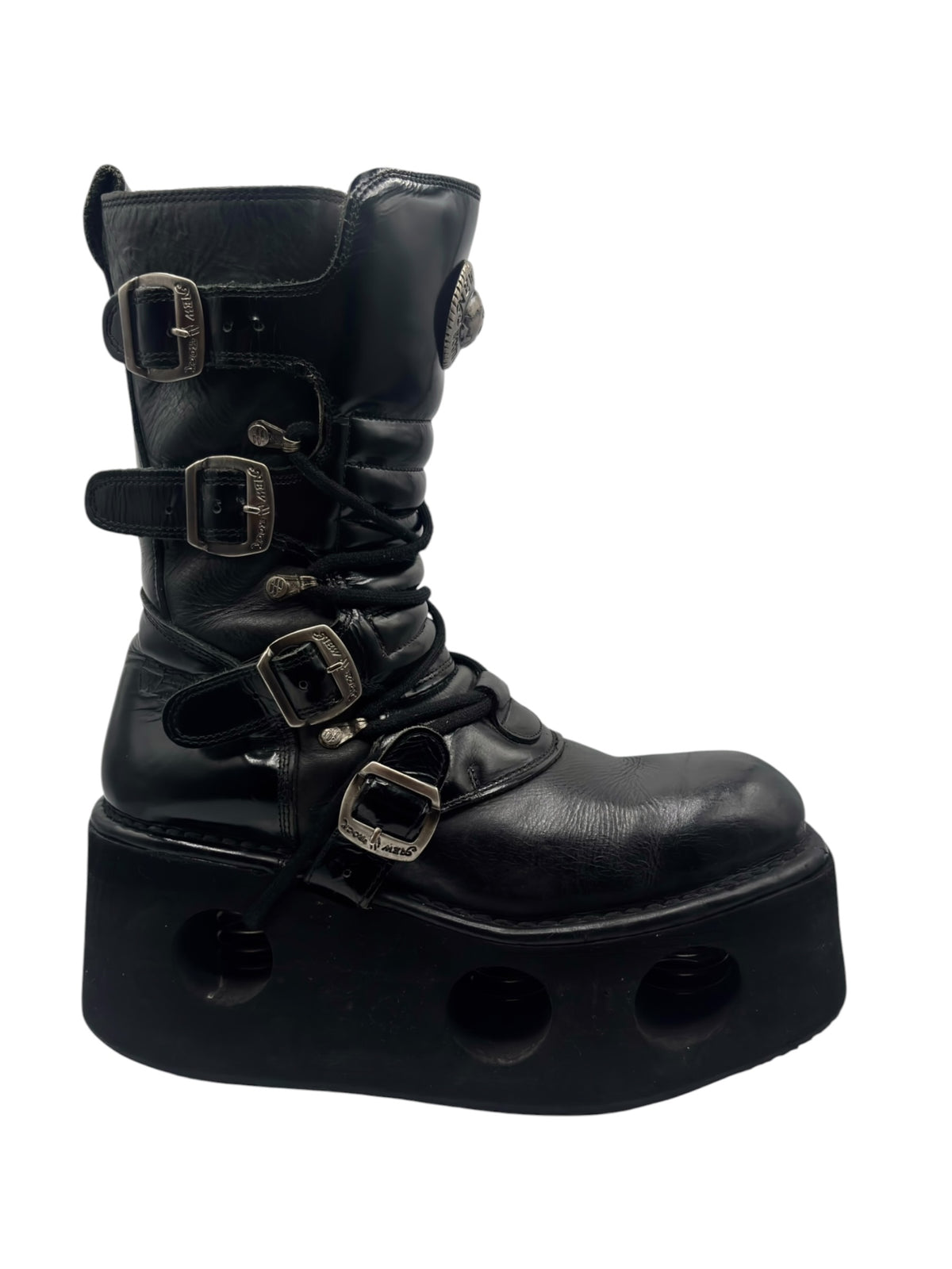 Black mid-calf platform boots with metal buckles, laces, and thick sole pods