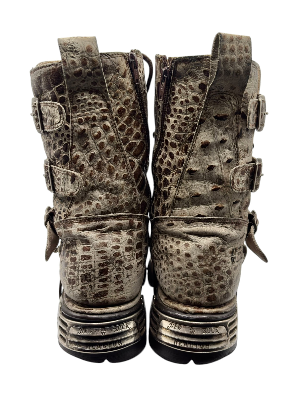 Pair of desert-camo leather boots from heel to toe with strap details and chunky soles