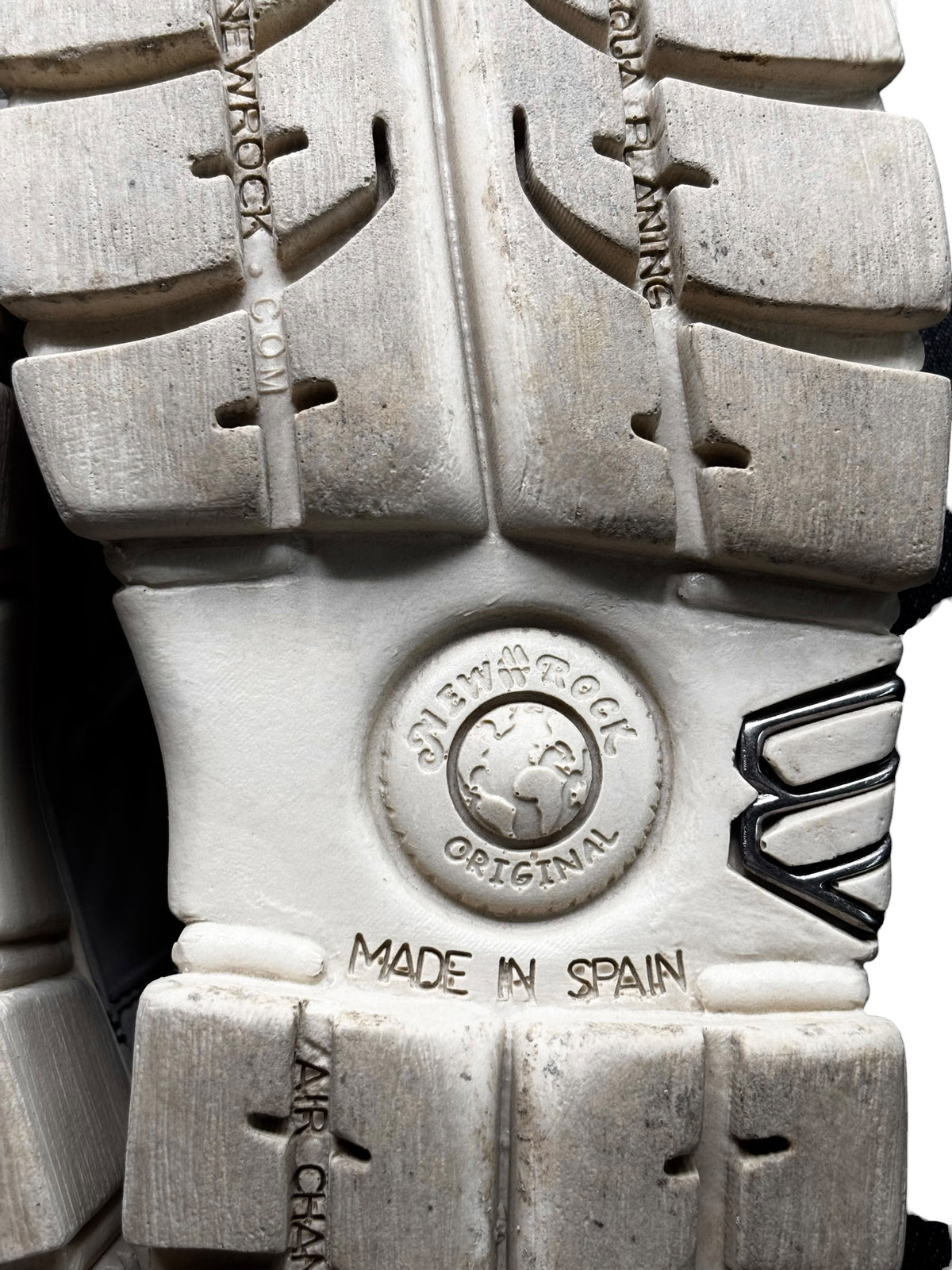 Beige platform boot outsole close-up with tread details and MADE IN SPAIN stamp