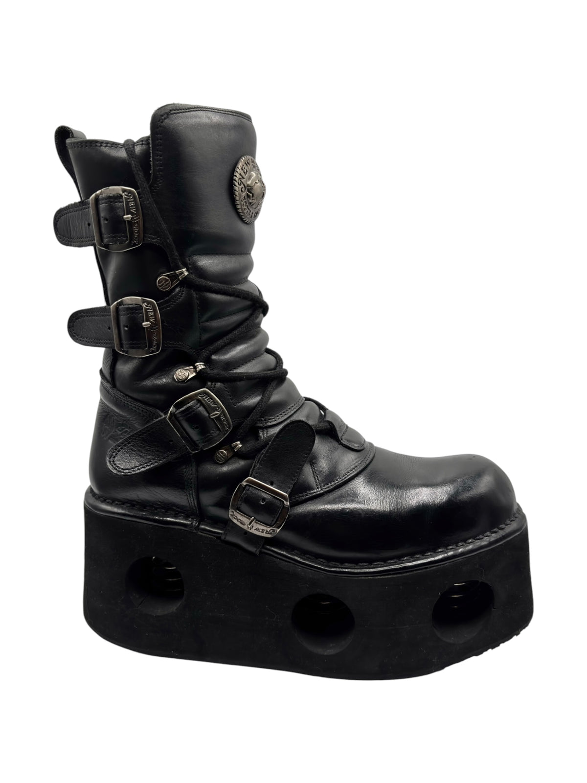 Vintage black platform boots with multiple buckles and crisscross lace-up