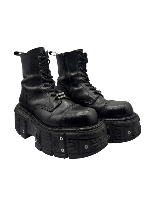 Black lace-up leather platform boots angled view with lace-up front and lug sole
