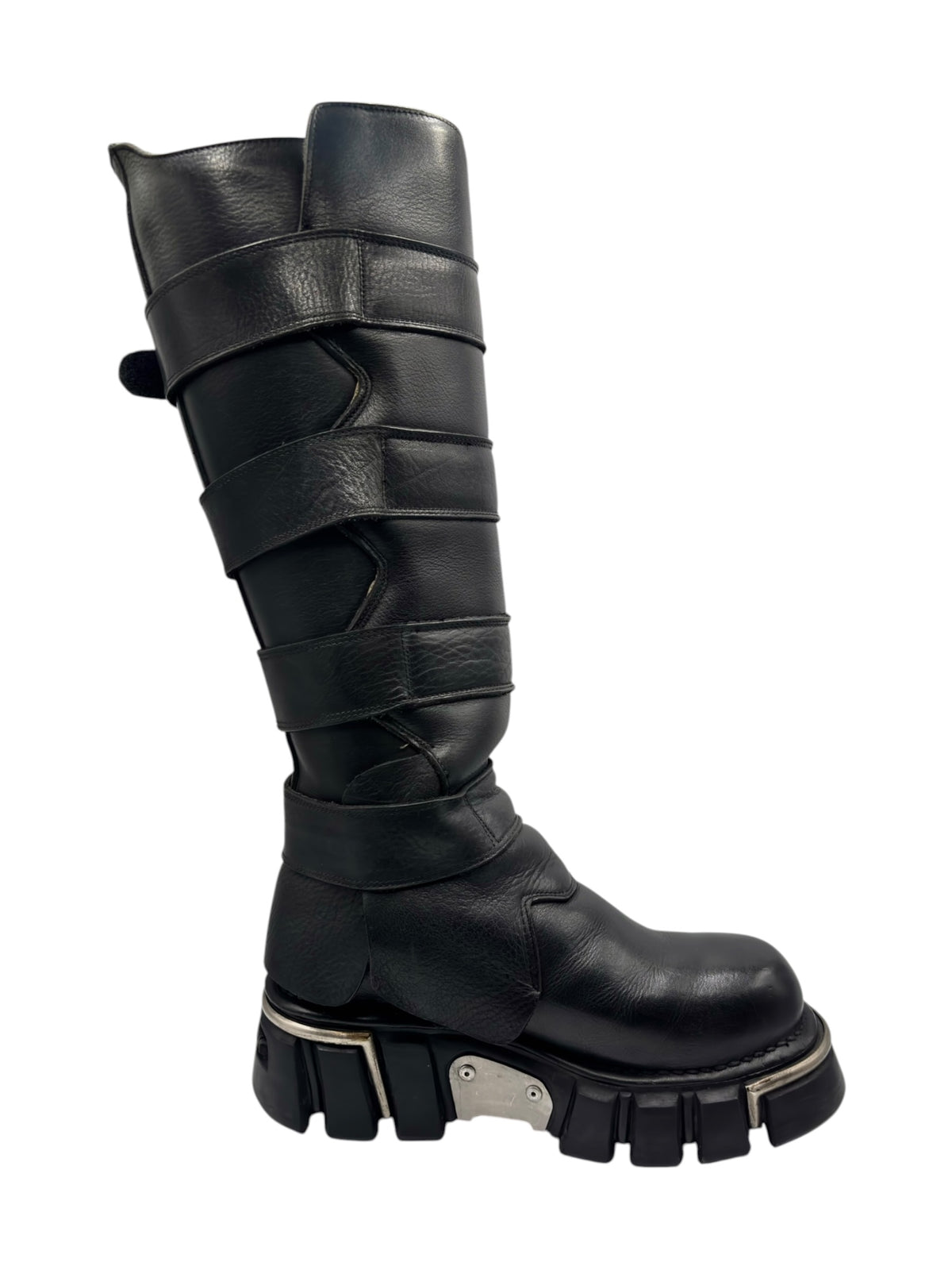 Black knee-high boots with side strap wraps and chunky lug tread platform