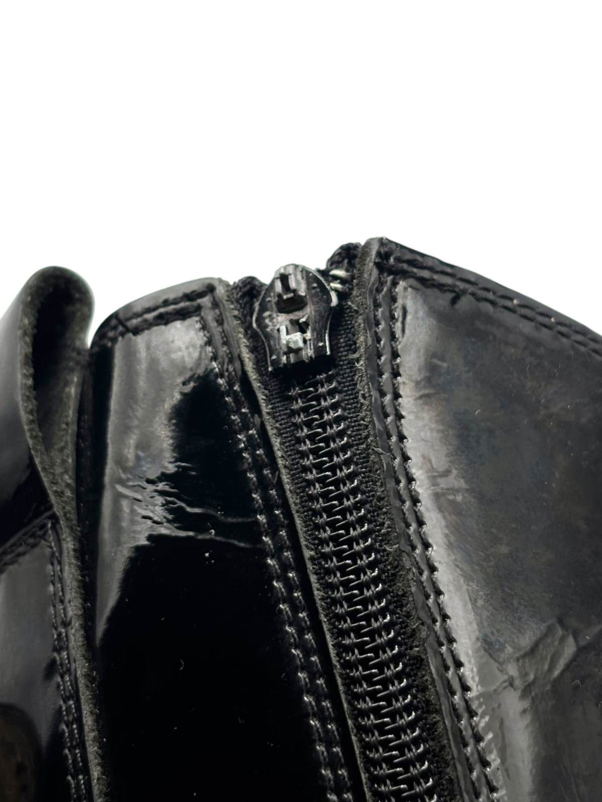 Vintage New Rock mid-calf leather boot close-up of center zipper and stitched seam