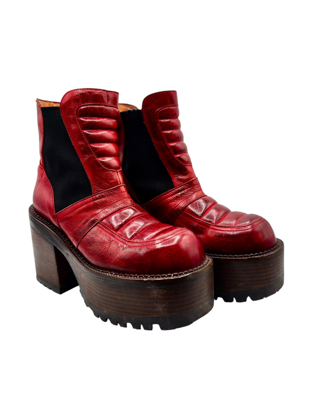 Red leather platform boots with black side panels, chunky block heel and lug sole