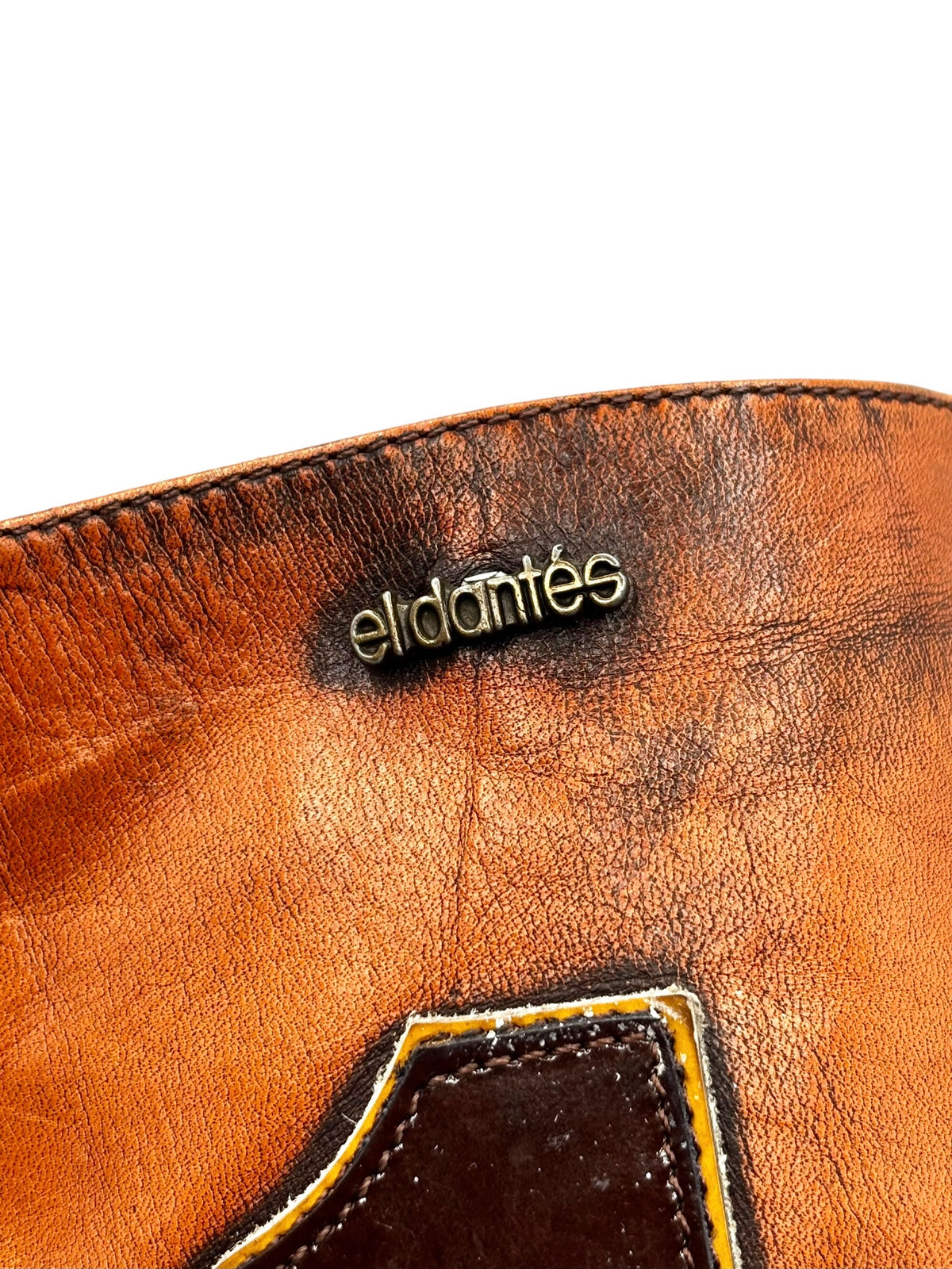 Vintage leather boot upper with “el dantes” logo and stitched number border
