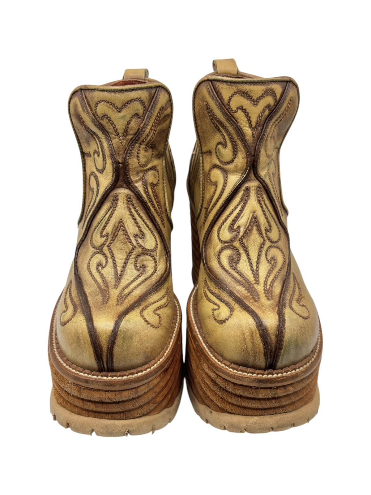 Khaki brown leather block platform boots with ornate stitched panels and ankle straps