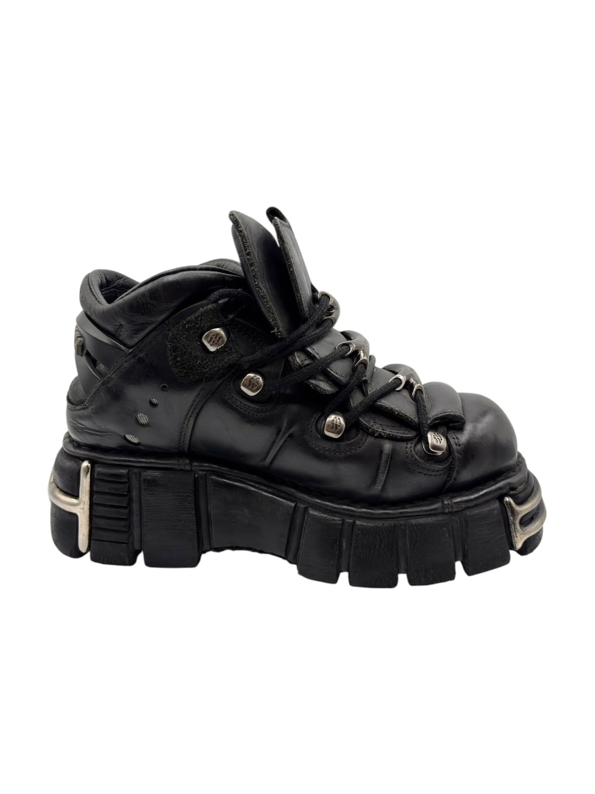 Black platform lace-up boot with side strap, metal eyelets, and rugged sole
