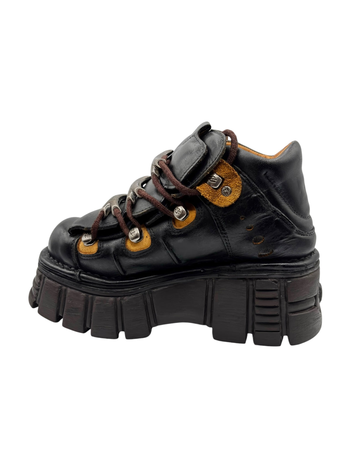Black leather lace-up platform boot with textured panels and thick tread sole.