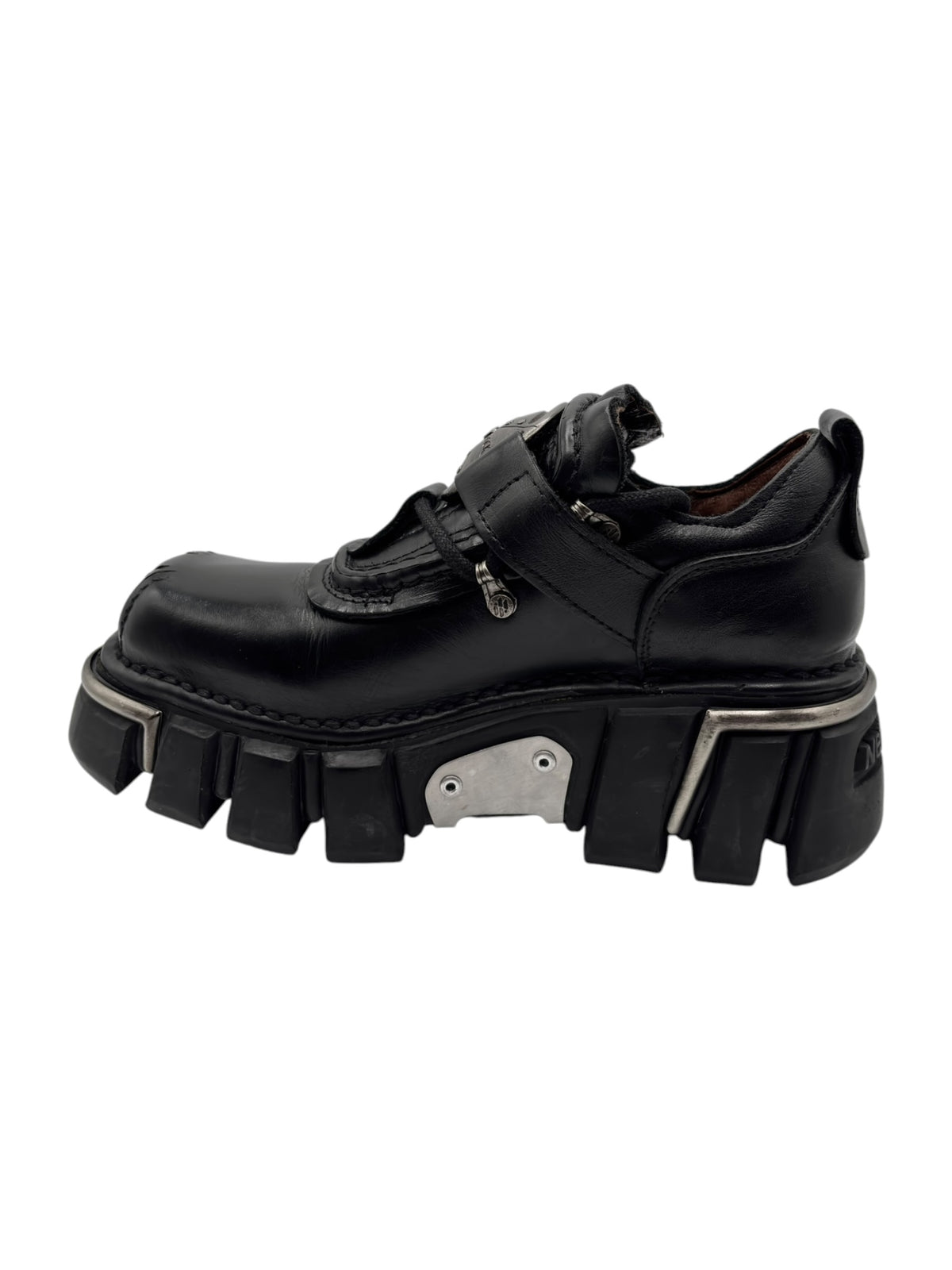 Black New Rock platform boots with strap closure and thick ribbed sole
