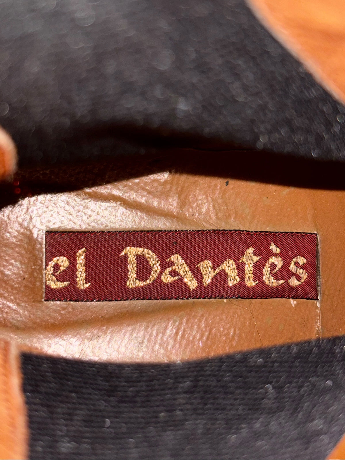 Red leather ankle boot with El Dantes label and black side panel stitching