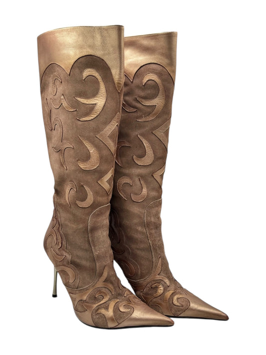 Brown vintage pointy leather knee-high boots with sculpted swirl cutout detail, stiletto heels