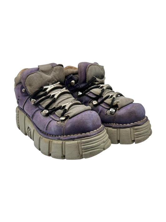 Two purple lace-up platform boots side view with chunky platform sole and tan lining