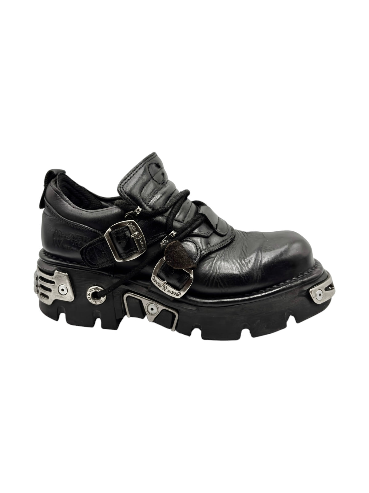 Black ankle platform boots with two top straps, silver buckles, and rugged tread.