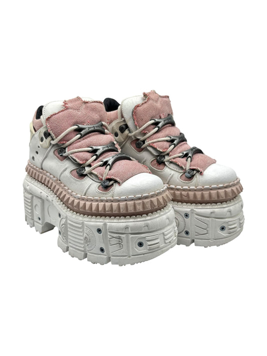 3/4 view of white and rose techno leather platform boots with thick lug sole