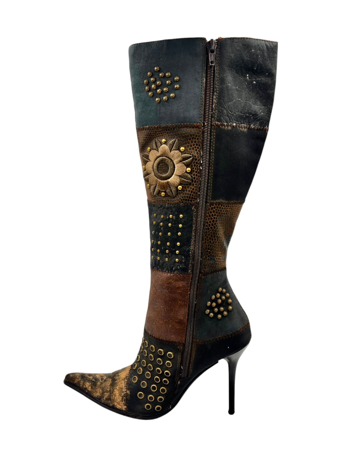 Knee-high boots with zipper closure and gold studs forming floral and dot patterns.