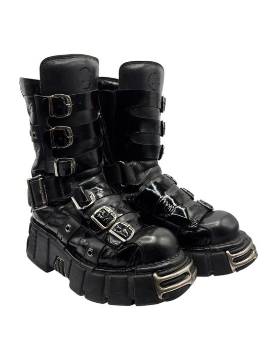 Black leather boots with triple side buckles and thick platform sole