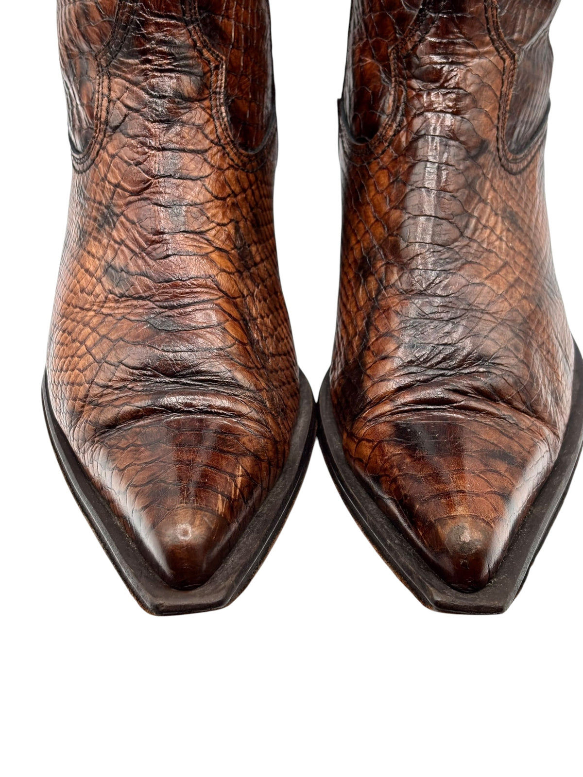Front view of brown snake-pattern cowboy boots with pointed toe