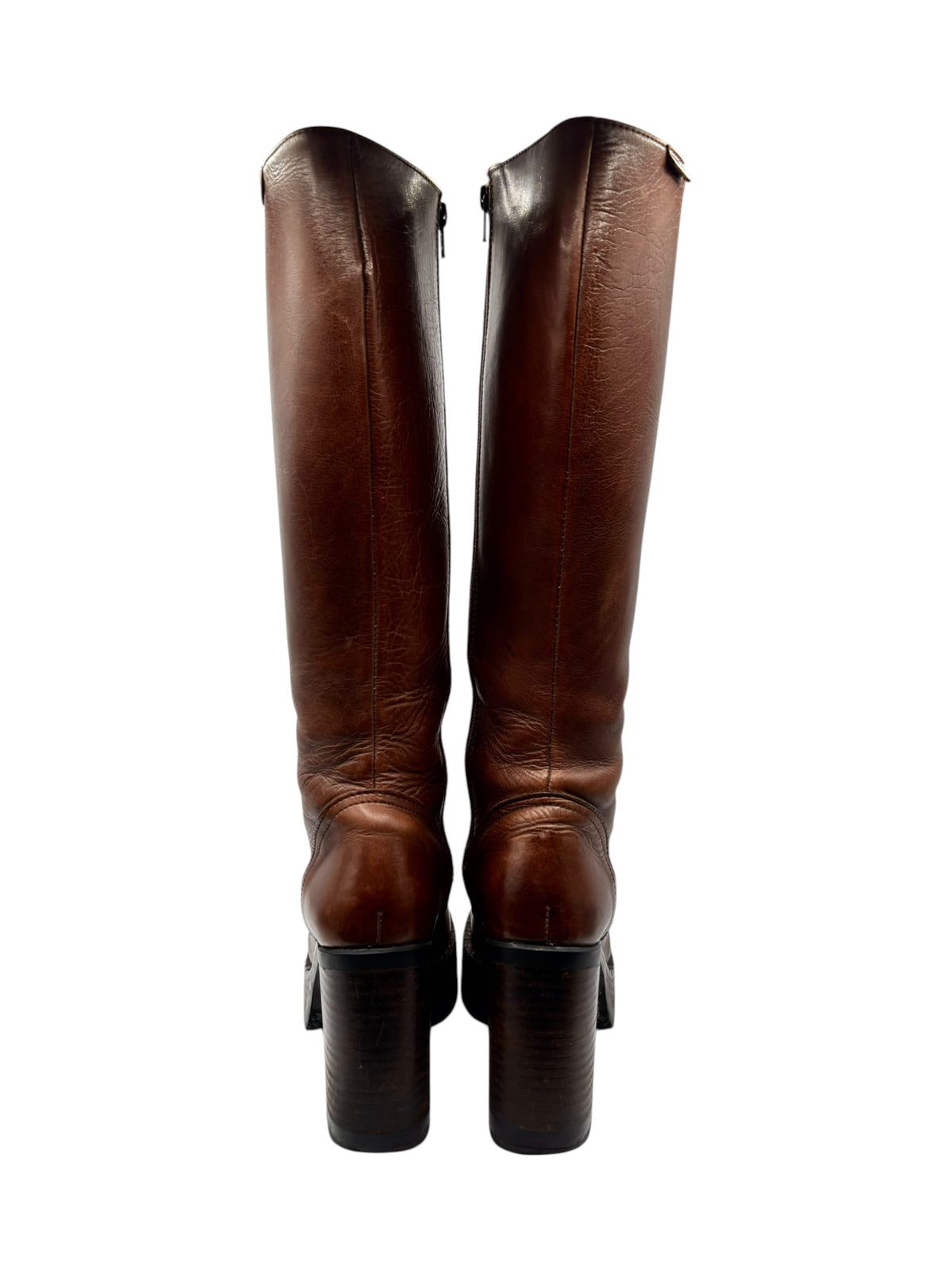 Pair of brown knee-high boots showing rear seams and block heels.