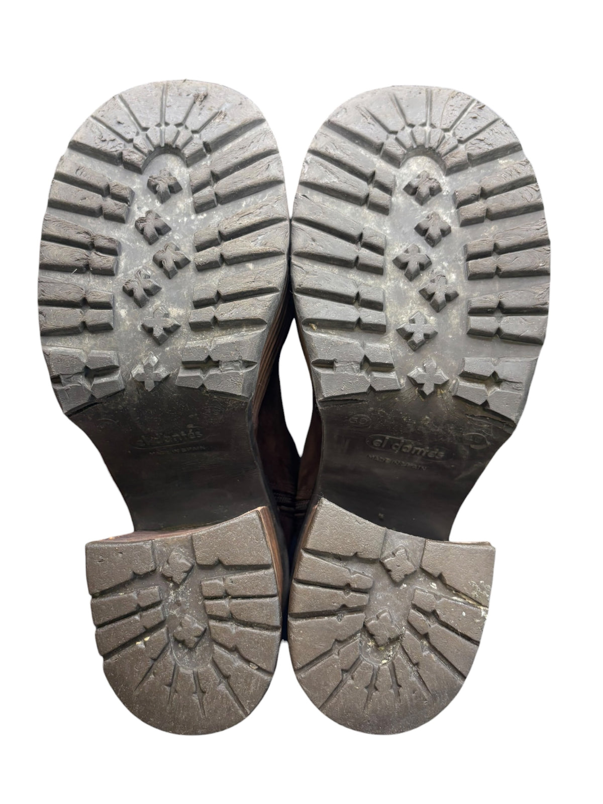 Pair of dark brown boot soles with chunky tread and embossed brand marks