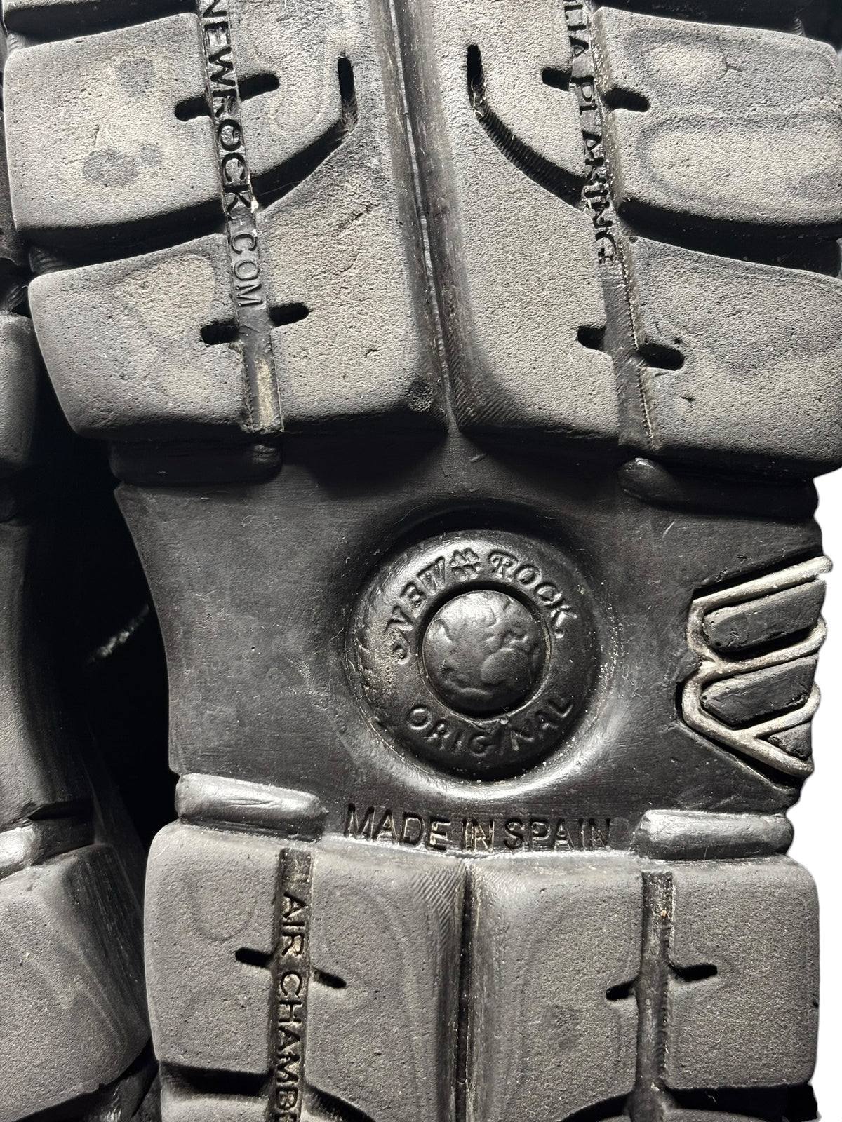 Vintage New Rock M.106 platform boots, close-up of textured gray outsole and stamps