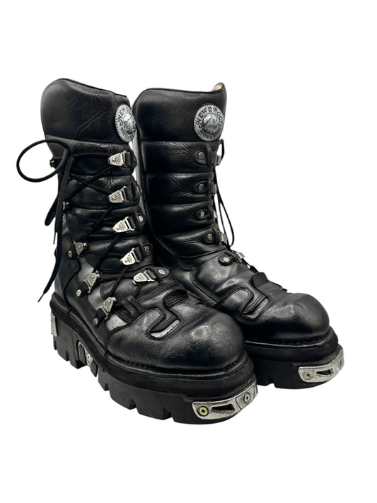 Vintage black leather lace-up reactor boots, front-left and front-right angle with metal caps