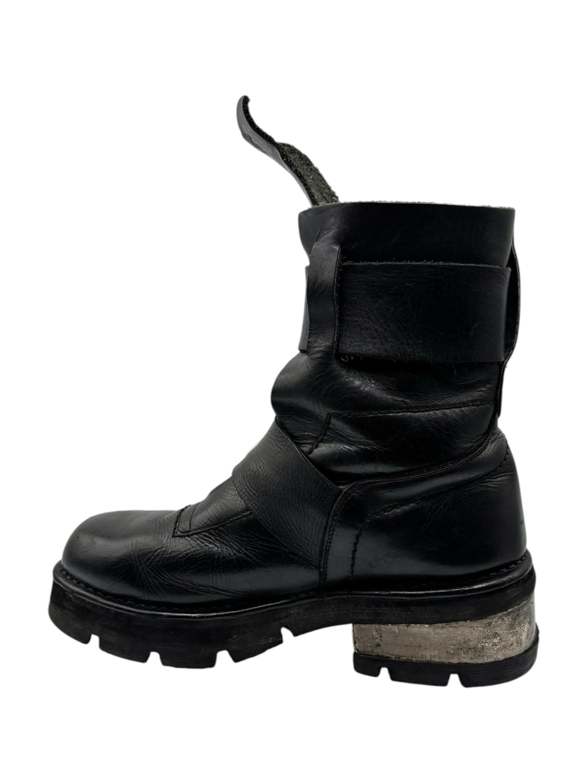 Black leather ankle boots with adjustable strap and rugged tread sole