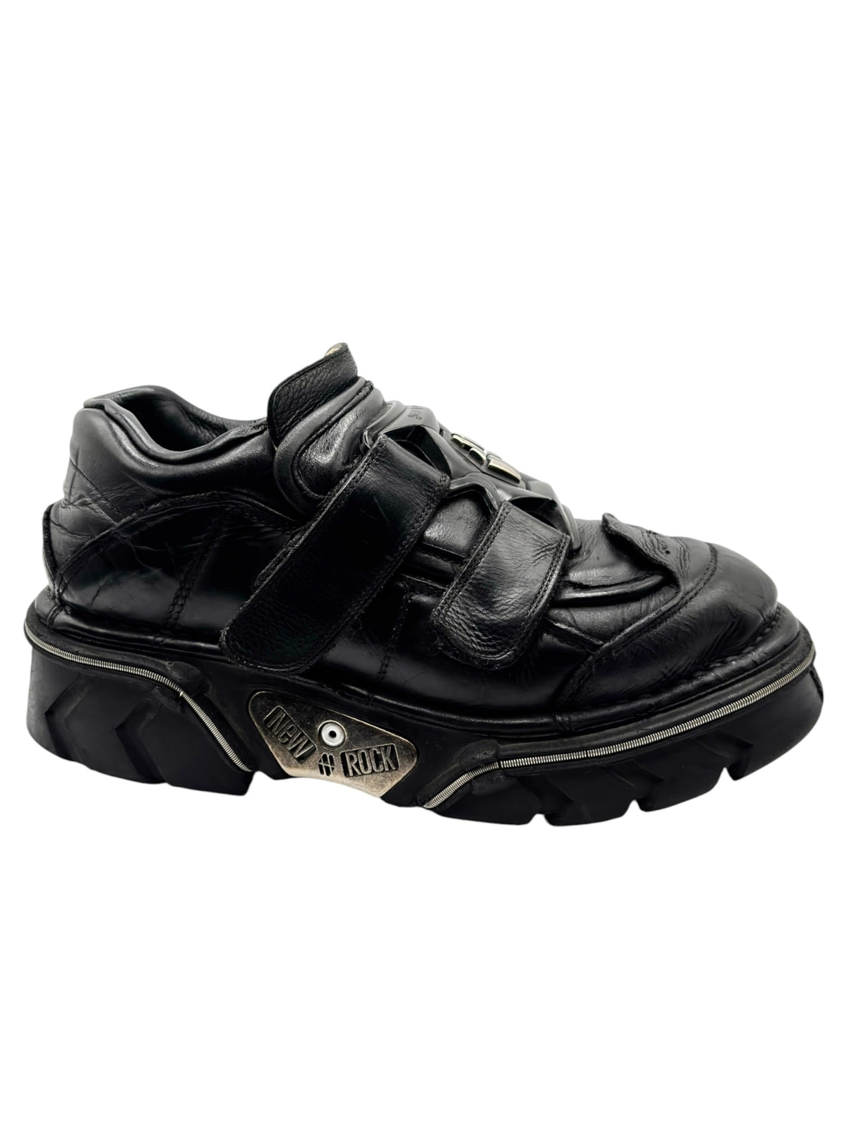 Black leather platform boots with heel emblem and rugged lug sole