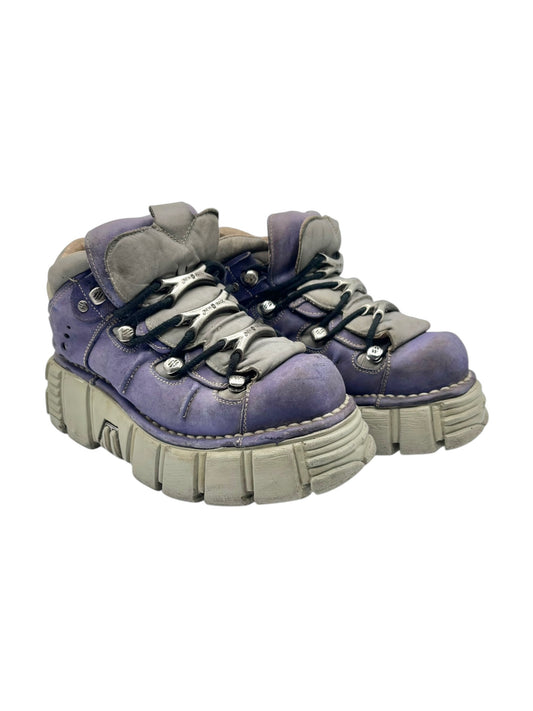 Pastel purple lace-up platform boots, front diagonal view with thick light sole