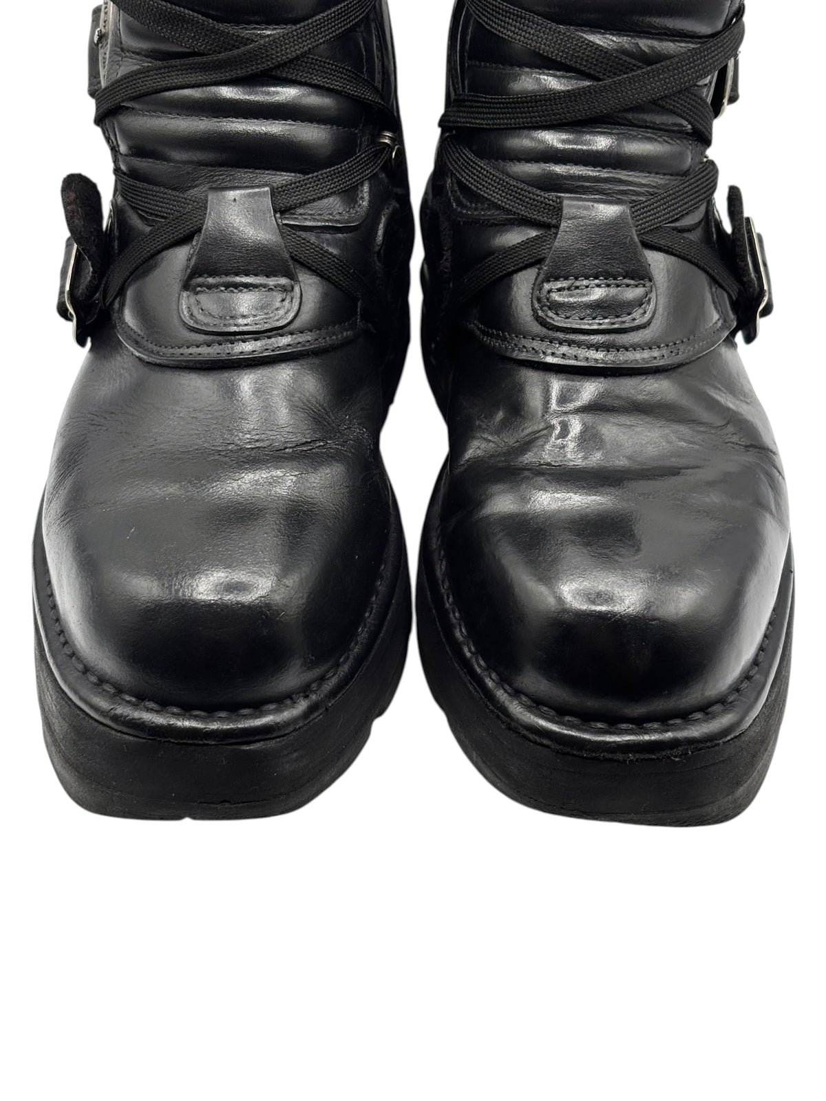 Black vintage raised-heel leather boots front view with lace and metal trim
