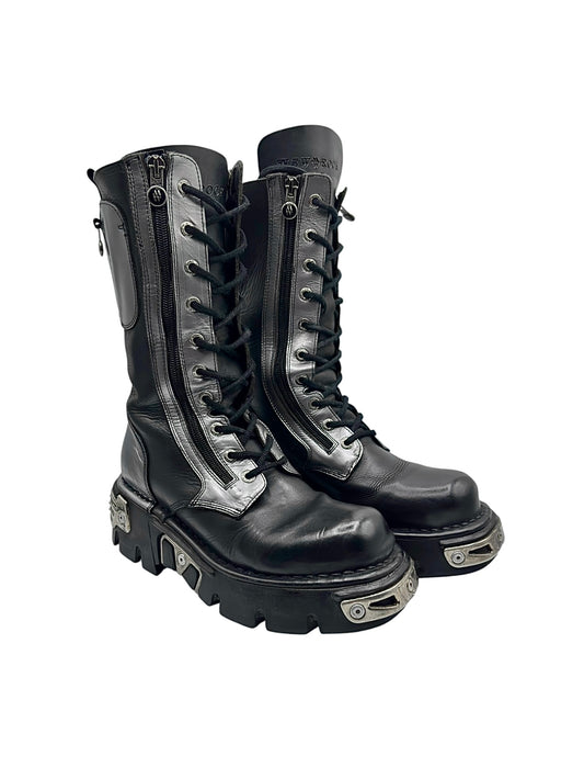 Black lace-up leather boots with side zippers and chunky lug sole