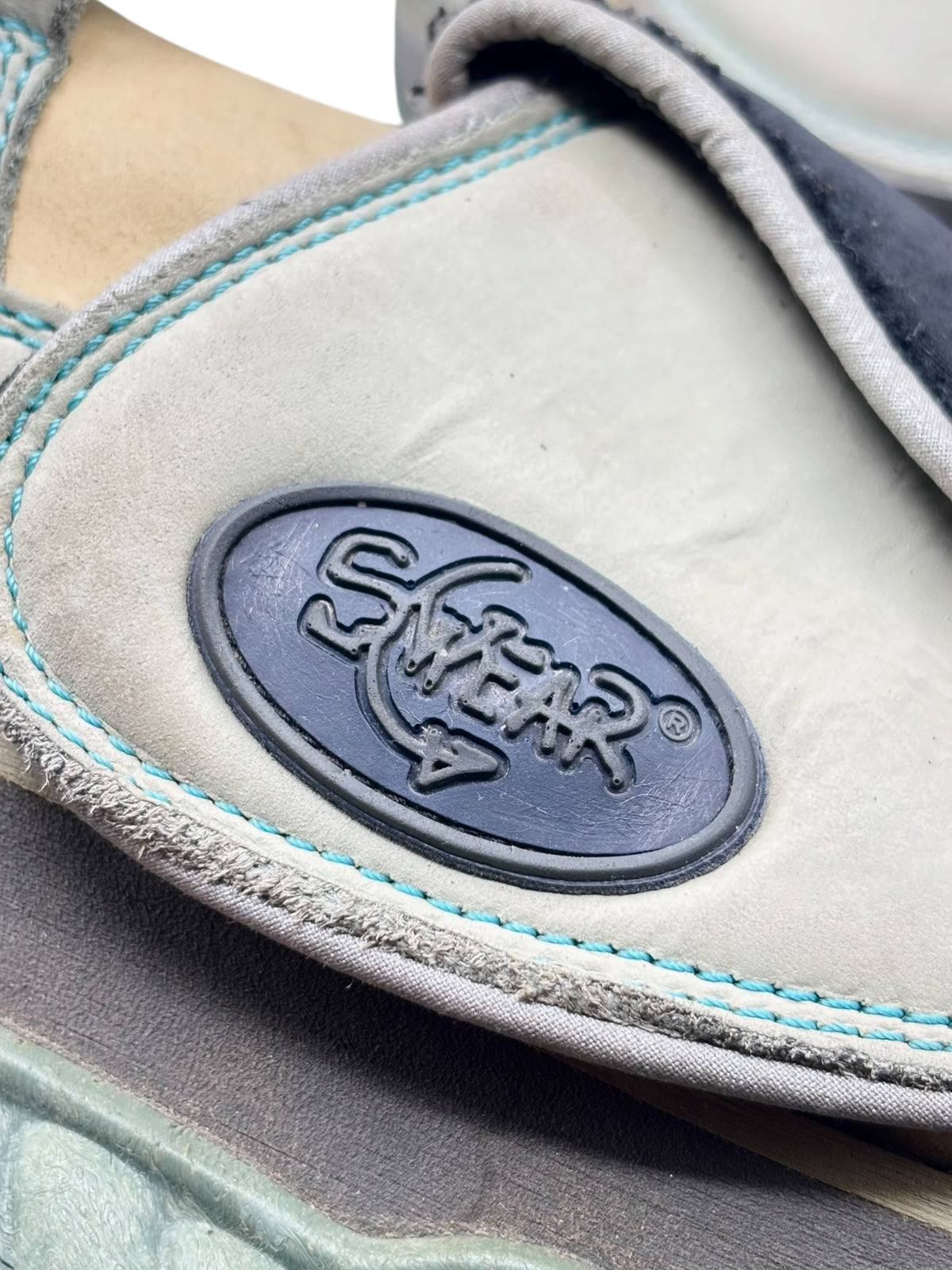 Swear platform boot heel side patch logo with blue stitching details