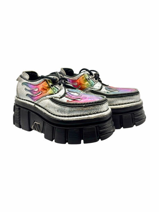 Set of white platform ankle boots with rainbow flame artwork and black tread sole