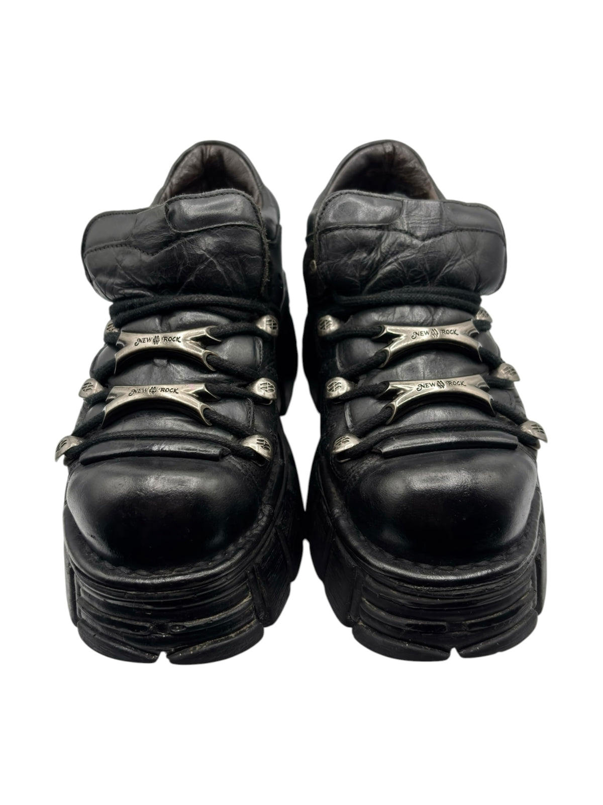 Vintage black leather lace-up platform boots with metal eyelets and thick ridged sole.