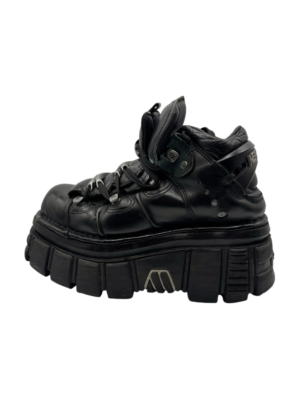 Black lace-up platform boots with padded collar and thick, ridged outsole.