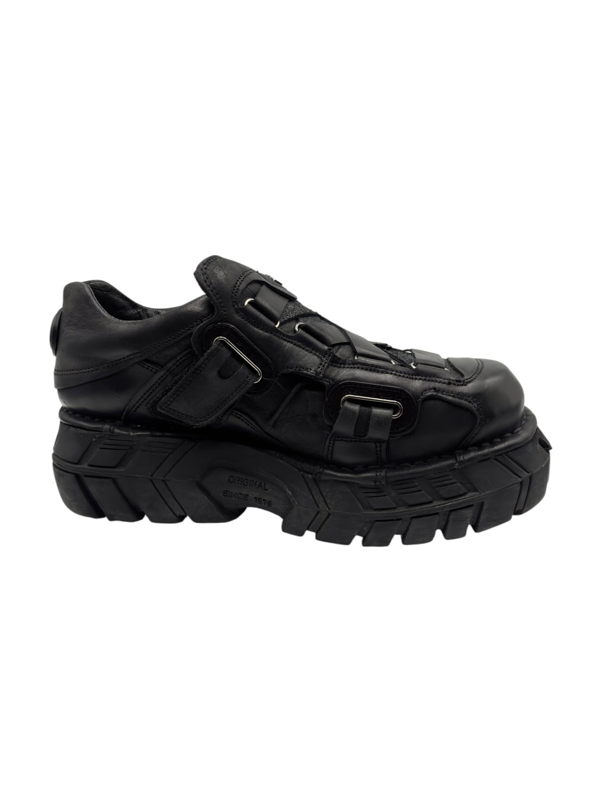 Black New Rock platform boots angled side view with buckle strap and layered upper panels