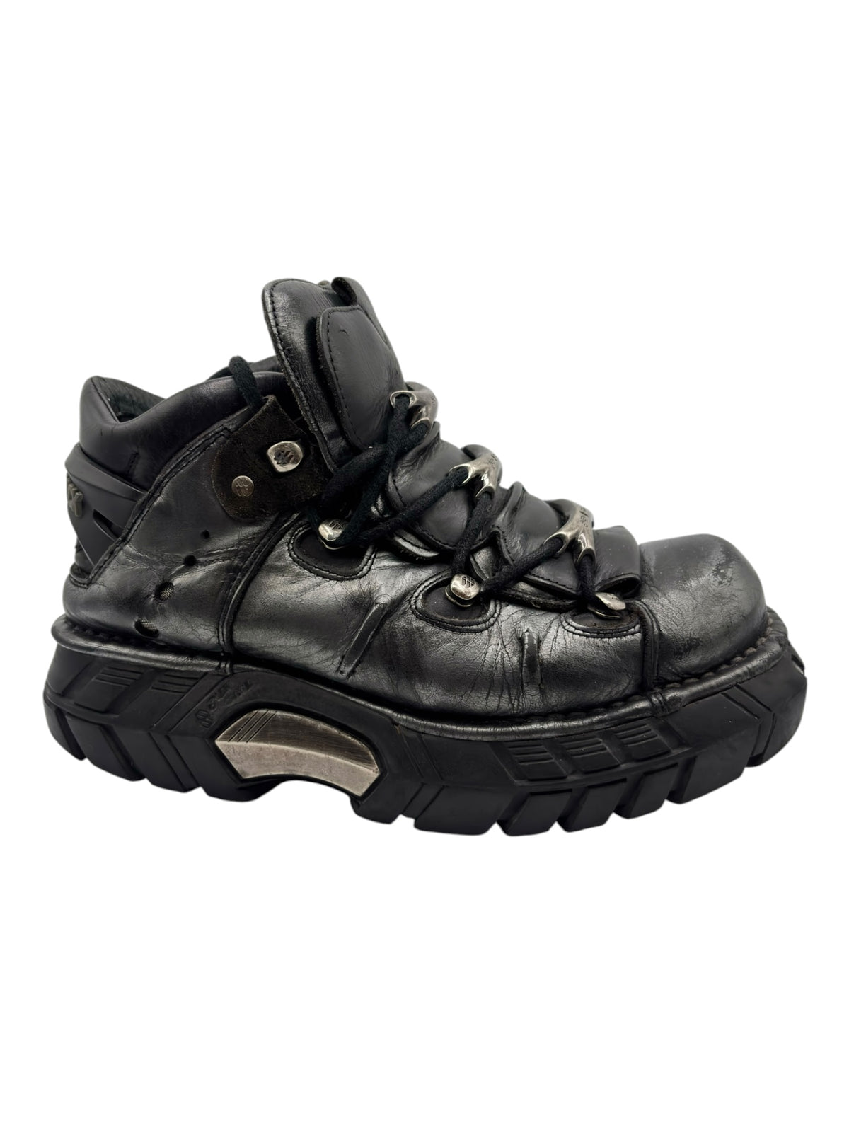 Black leather lace-up platform boots with metal eyelets and rugged outsole