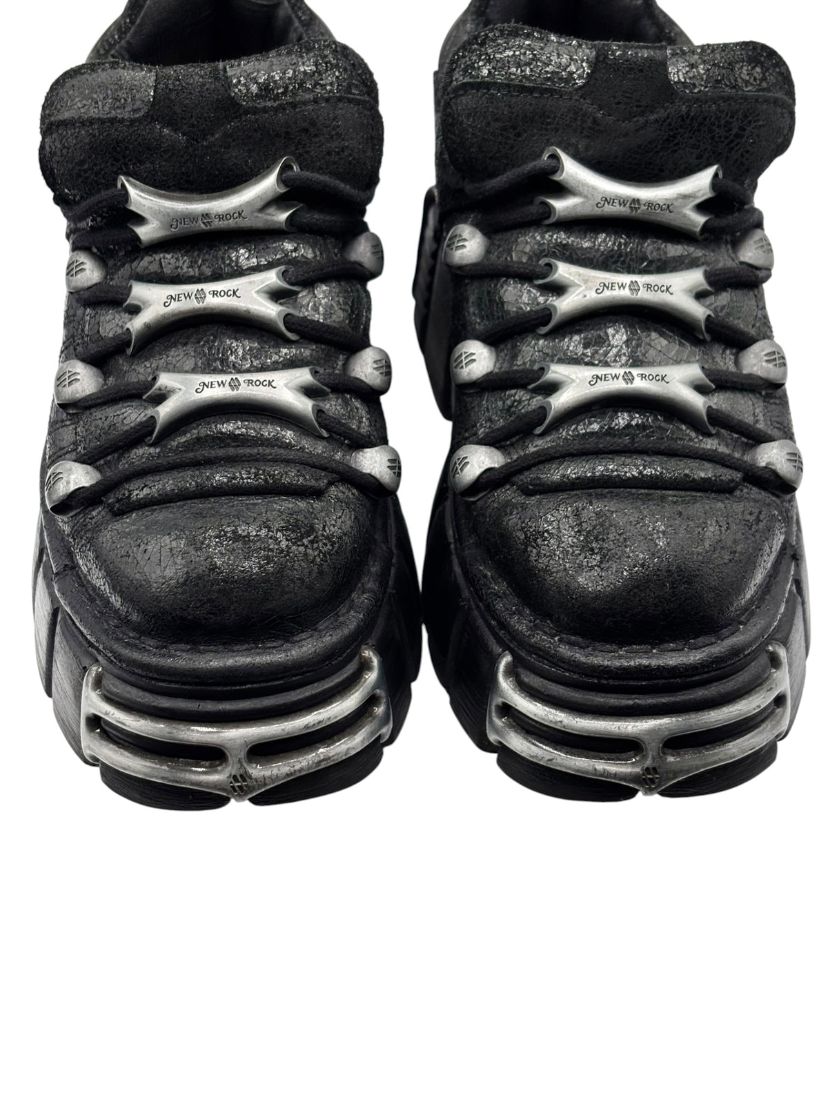 Black platform boots top view with lace-up closure and silver “New Rock” accents