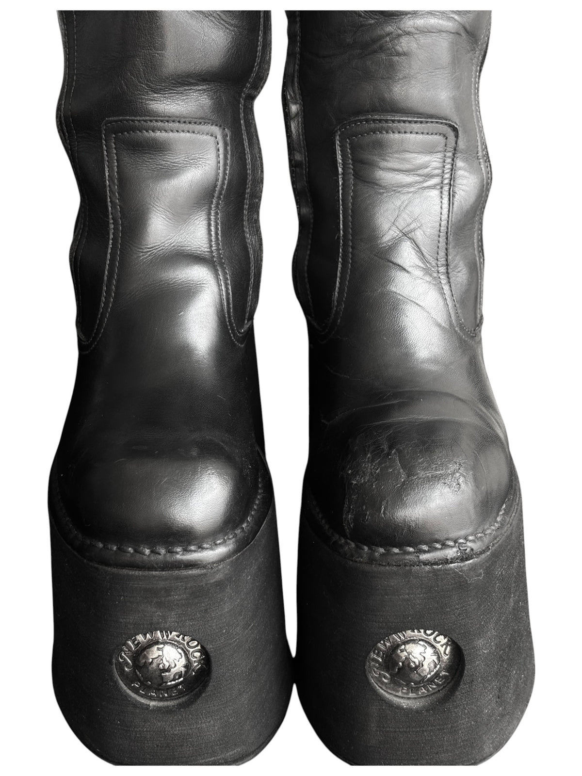 Knee-high platform boot toe and vamp view with stitched panels