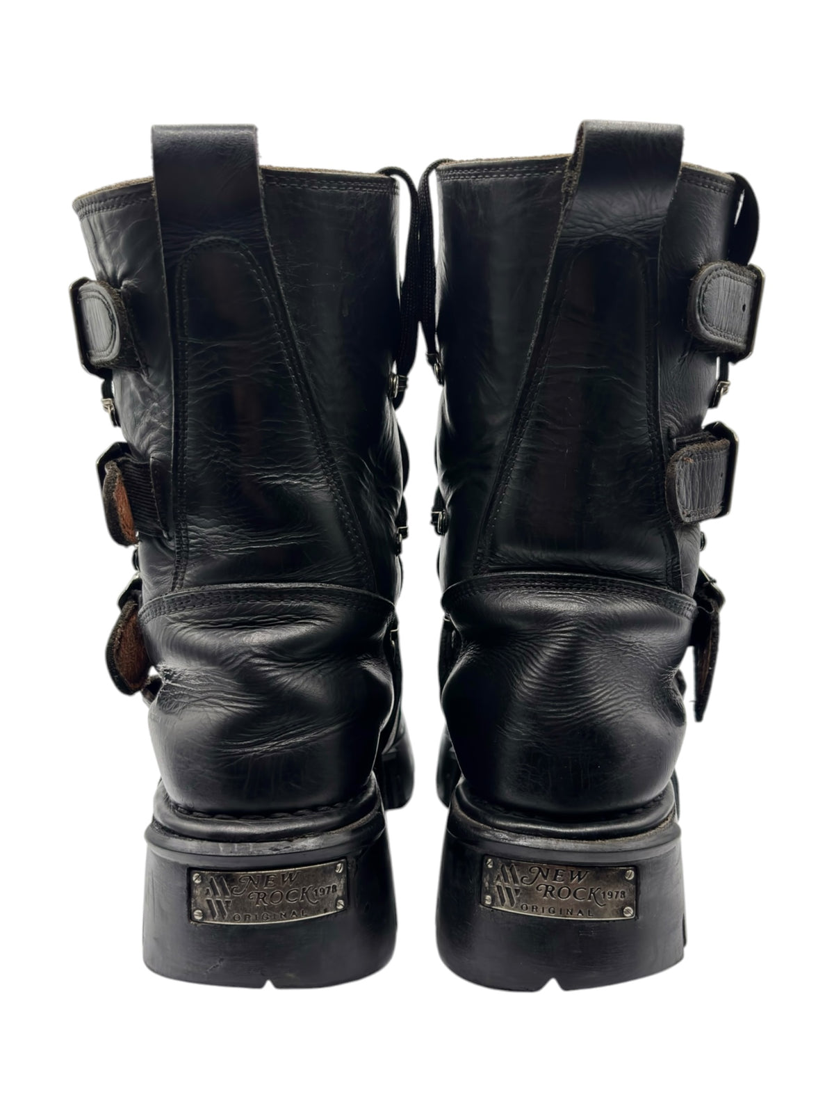 Back view of black mid-calf boots with dual straps and metal hardware