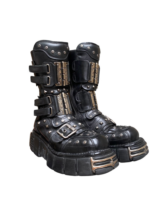Black studded leather platform boots with side straps and buckles