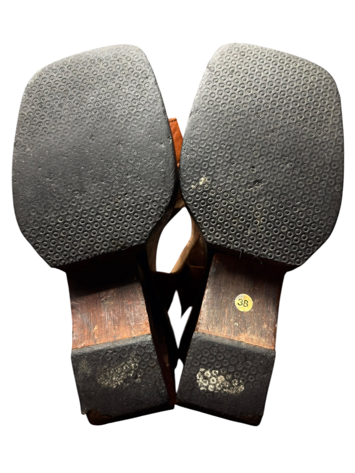 Pair of brown leather platform sandal bottoms with textured tread and size 38