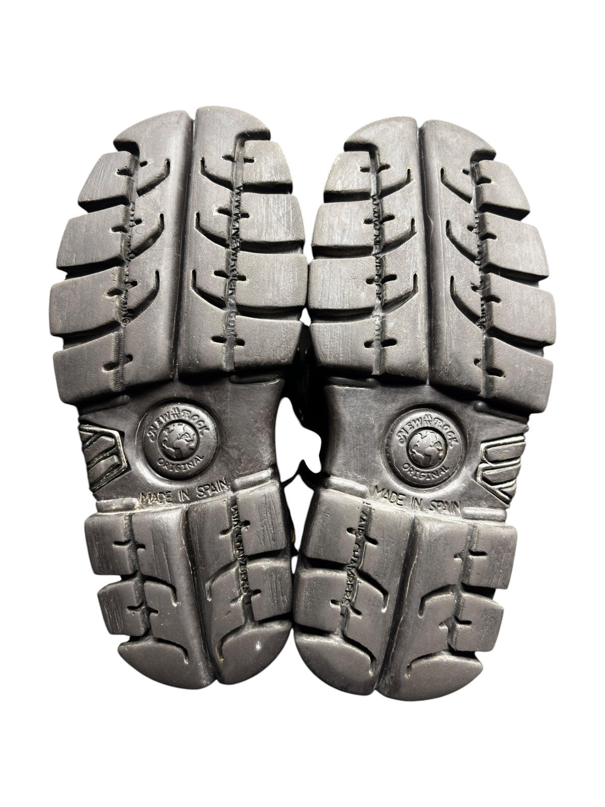 Pair of black platform boot soles with chunky tread and stitched panels.