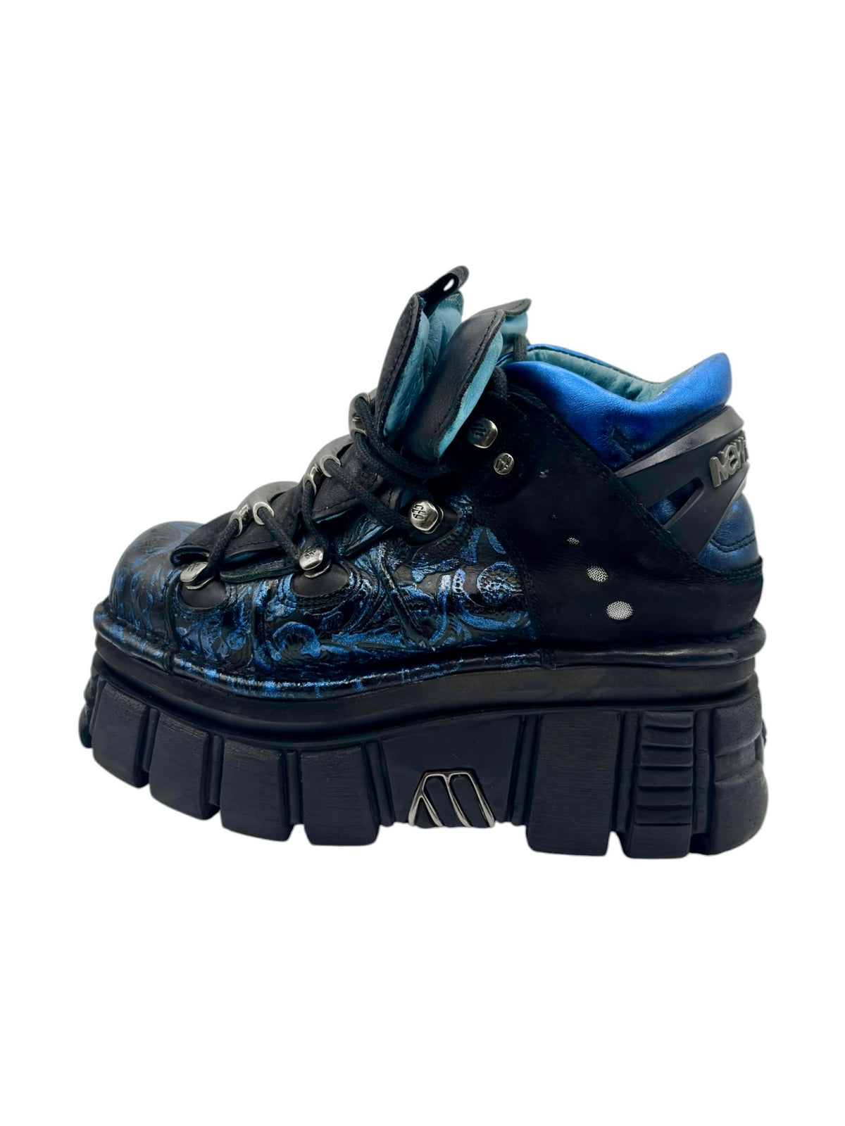 Blue patterned platform boots with black laces and chunky rubber sole