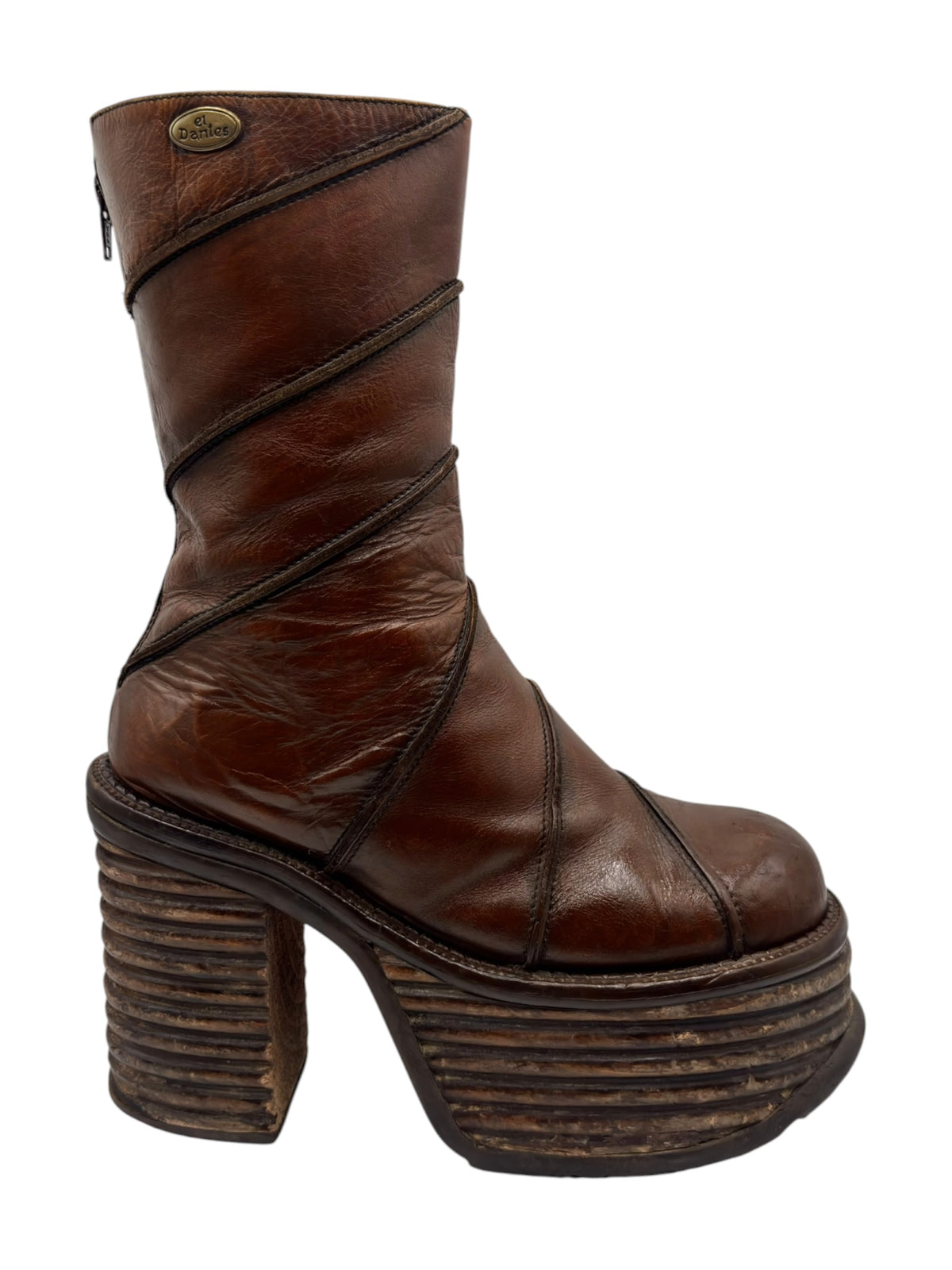 Front-angled view of brown mid-calf boots with diagonal panel stitching and stacked heel.