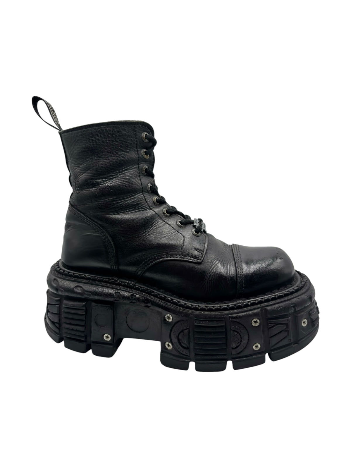 Black leather lace-up platform boot viewed from side with thick lug sole.