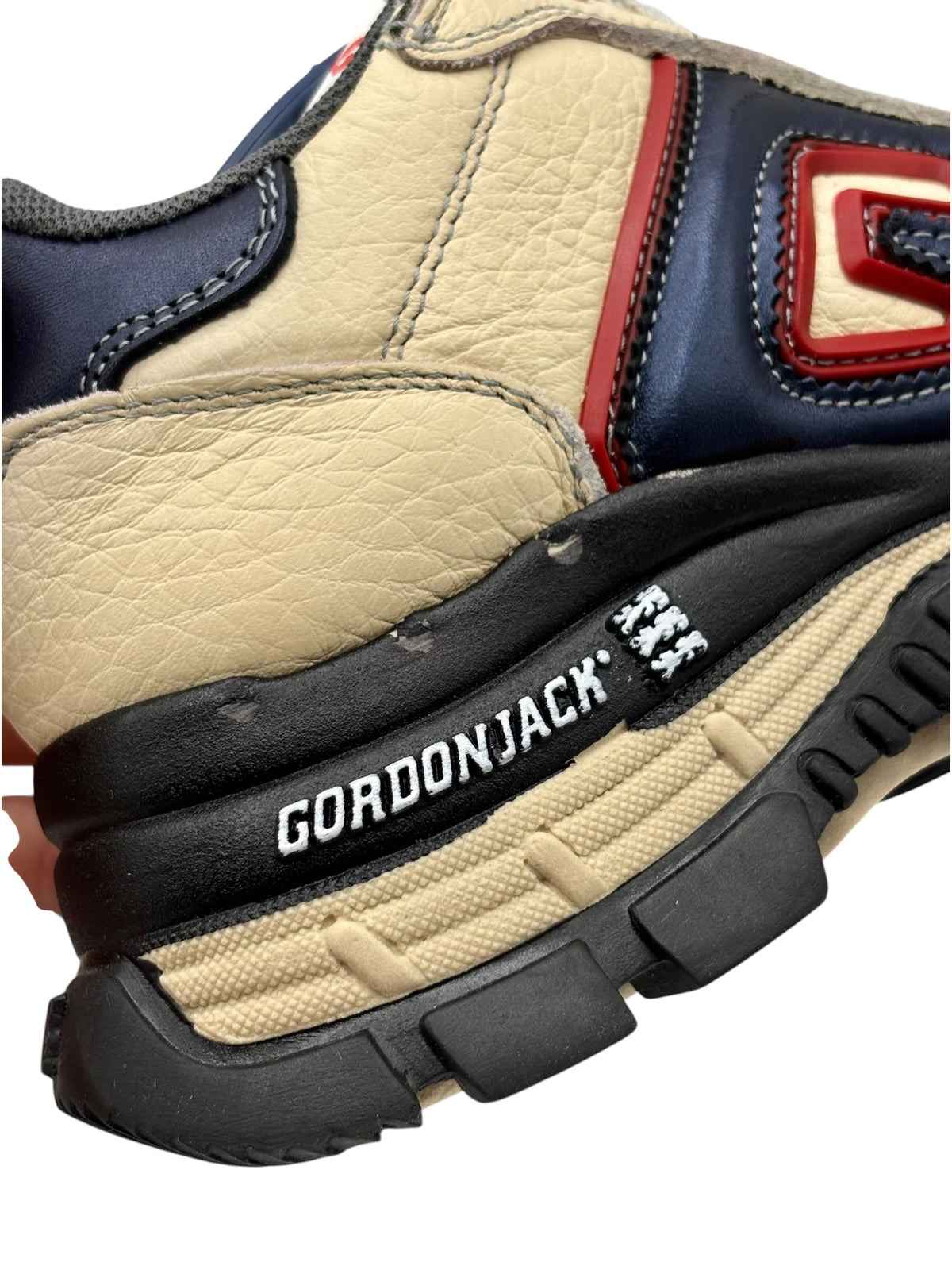 GORDONJACK branded heel trim on beige platform sneaker with black tread sole