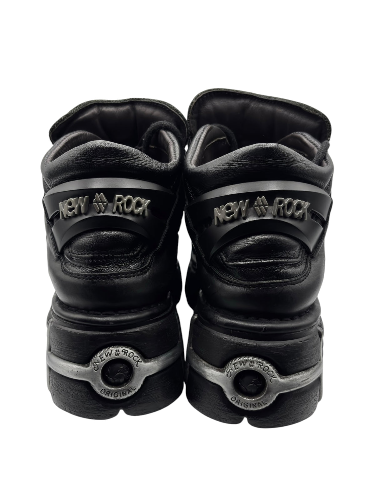 Black platform boots back view with ankle cushioning and logo heel tabs.