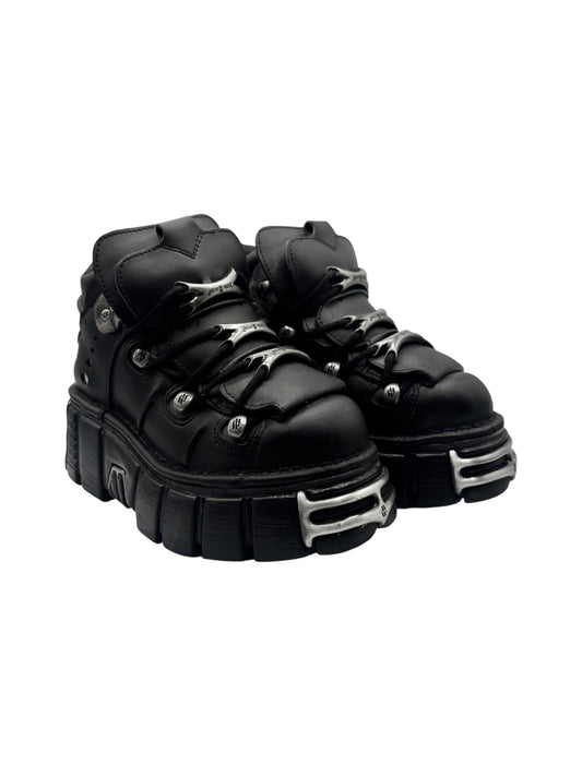 Black platform boots front-left and front-right angled views with lace-up