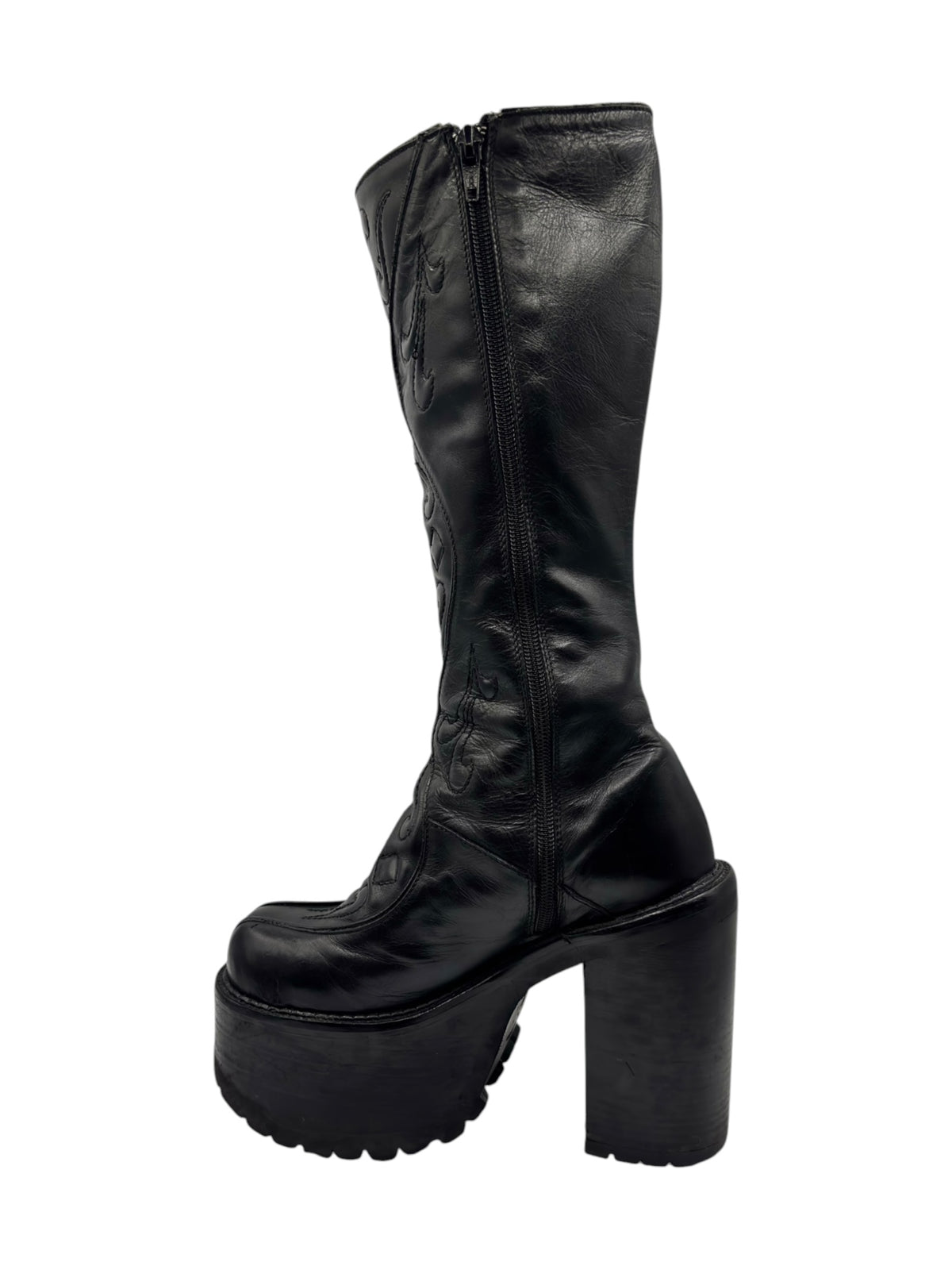 Black knee-high leather platform boots with tall shaft and chunky heel